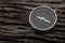 Compass, navigational compass on wooden background