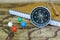 Compass, notebook and marking pins on blur vintage world map, journey concept