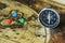 Compass and pins on blur vintage world map, journey concept