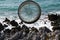 Compass on Rocks With a Sea. Close up Antique Compass. Compass with Natural Background Blur. Travel concept