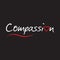 Compassion word text with red love heart - typography design on black background