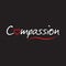 Compassion word text with red love heart - typography design on black background