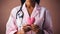 A compassionate woman healthcare doctor in pink, dedicated to wellness