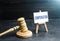 Compensation and judge`s gavel. Award of moral financial compensation for caused damage. Lawyer services. Workers rights