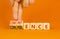 Competence and confidence symbol. Concept word Competence Confidence on wooden cubes. Businessman hand. orange table