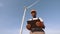 Competent technician using digital tablet while controlling working process of wind turbines outdoors. African american