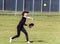 Competing in high school softball game