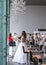 Competition of wedding stylists. Models in wedding dresses and hairstyles are waiting for the jury\'s evaluation.