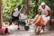 Competitions in amusement park - who will quickly bring girl in the garden wheelbarrow