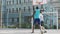 Competitive basketball players dribbling ball at court, active lifestyle, sports