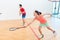 Competitive Chinese woman holding the racquet during a squash game