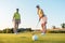 Competitive woman looking at the golf ball with disappointment