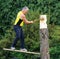 A competitor chops his log with an axe in the wood chopping event at a country show