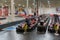 Competitors are lined up for the start of a new race at an indoor kart track