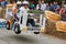 Competitors Racing Bus Vehicle Get Airborne At Soap Box Derby