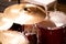 Complete set of cymbal instruments with complete red drums in studio music concept