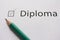 Complete training, get diploma. To fulfill set goal. word DIPLOME is written on white paper in pencil, marked with tick.