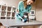 Complete trust. Positive female veterinarian bandaging a paw of a big black cat lying on the table in veterinary clinic