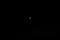 Completely black background with wedge of moon and star