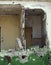 Completely destroyed house with broken walls