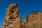 Almost completely destroyed remains of the wall of the temple of Kamira with the holy mountain Jebel Barkal in the background