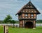 Completely newly renovated small half-timbered house with a barn floor on a meadow in front of an asparagus field covered with