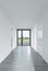 A completely white hallway corridor in a residential building