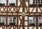 Complex pattern of intersecting timbers in facade of half-timbered medieval house in Mainz, Germany