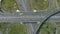 Complex Road Junction and Cars Traffic in Sunny Summer Day. Aerial Vertical Top-Down View. Vertical Video