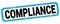 COMPLIANCE text written on blue-black rectangle stamp