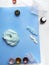 Components to make slime. Child education concept. On blue surface slime, toothpaste, shaving foam, decorative accessories, color