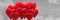 Composed image of red heart balloons on grey sky background