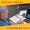 Composite of caucasian senior businessman using laptop and social media kindness day text