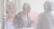 Composite of cheerful senior woman in mirror putting on lipstick, and greeting visitor at front door