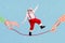 Composite collage image of two hands hold rope excited mini santa claus walking balancing isolated on drawing snowfall