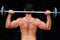 Composite image of bodybuilder lifting barbell