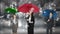 Composite image of businessman and businesswoman holding an umbrella