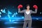 Composite image of businesswoman with boxing gloves