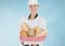 Composite image of Chef with bread against blue background