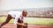 Composite image of close up of businessman in starting blocks