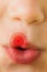 Composite image of close up of childs mouth pouting