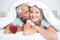 Composite image of closeup of mature man kissing womans cheek in bed