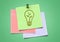 Composite image of colored Sticky Note Lightbulb Green Idea Icon