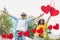 Composite image of couple enjoying together against hearts hanging on a line