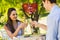 Composite image of couple toasting champagne flutes at an outdoor cafÃ©