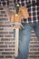 Composite image of cropped image of handyman wearing tool belt