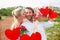 Composite image of cute couple going for a picnic with woman kissing boyfriends cheek