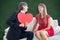 A Composite image of cute geeky couple with red heart shape