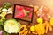 Composite image of digital tablet surrounded with fresh fruits and vegetable