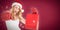 Composite image of festive blonde with boxing gloves and shopping bag